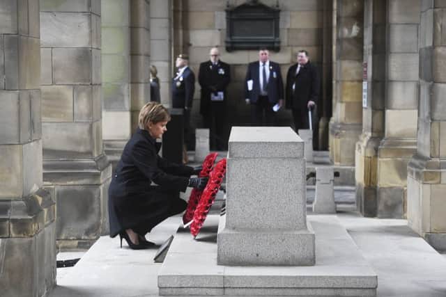 First Minister Nicola Sturgeon lays a wreath. Picture: Greg Macvean