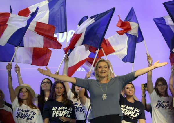 France's far-right National Front president Marine Le Pen waves to supporters. Picture: AP