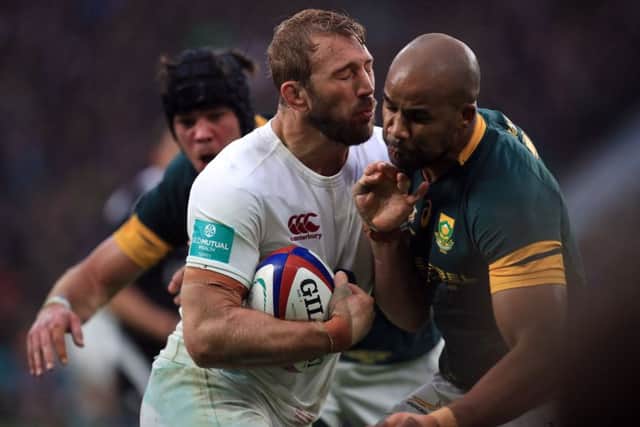 England back row Chris Robshaw tries to burst through a JP Pietersen tackle. Picture: PA.