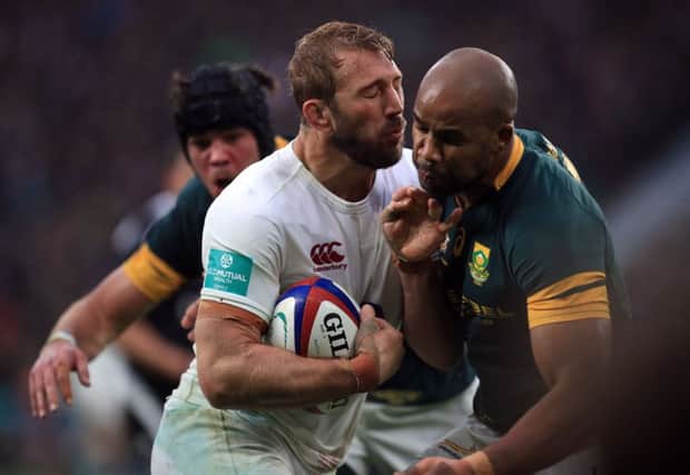 England back row Chris Robshaw tries to burst through a JP Pietersen tackle. Picture: PA.