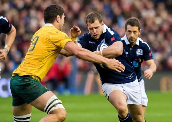 Scotland debutant Allan Dell takes on Australia's Rob Simmons during the home side's narrow loss at BT Murrayfield. Picture: SNS