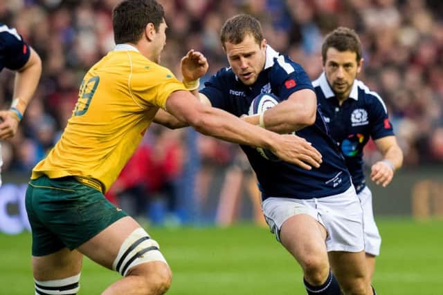 Scotland debutant Allan Dell takes on Australia's Rob Simmons during the home side's narrow loss at BT Murrayfield. Picture: SNS