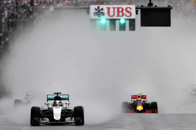 Lewis Hamilton leads Max Verstappen on his way to victory at a rain-soaked Interlagos. Picture: Mark Thompson/Getty Images