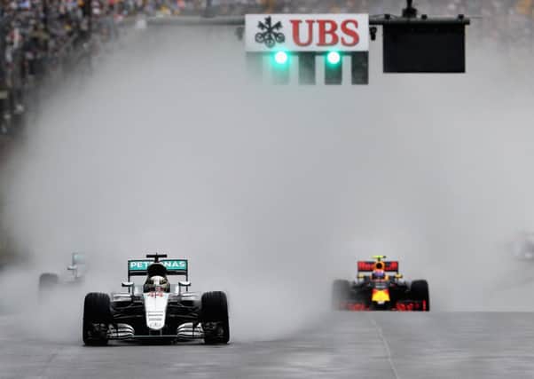 Lewis Hamilton leads Max Verstappen on his way to victory at a rain-soaked Interlagos. Picture: Mark Thompson/Getty Images