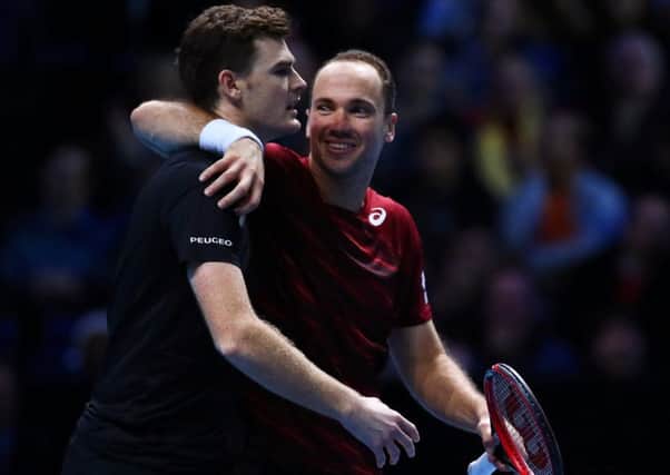 Jamie Murray, left, and Bruno Soares celebrate victory in their doubles match against Treat Huey and Max Mirnyi. Getty.