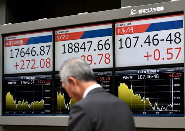 Tokyo stocks rose as the weaker yen lifted exporters and sentiment was buoyed by hopes for president-elect Donald Trump's administration. Picture: Kazuhiro Nogi/AFP/Getty Images