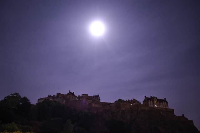 A full moon is seen over Edinburgh Castle in September 2015. Picture: SWNS