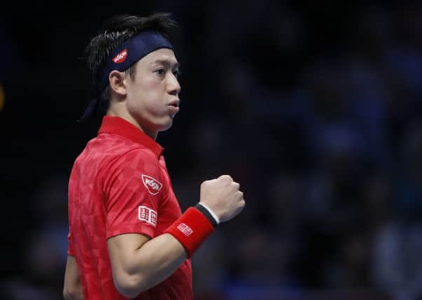 Kei Nishikori of Japan celebrates during his victory over Stan Wawrinka during the ATP World Tour Finals in London. Picture: Kirsty Wigglesworth/AP