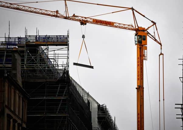 Girders are lifted by crane from Renfrew Street onto the roof of the Glasgow School of Art, Mackintosh Building. Picture: Jeff J Mitchell/Getty Images