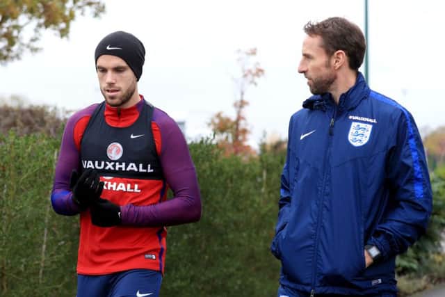 Gareth Southgate talks with Jordan Henderson yesterday after naming him as England captain. Picture: PA