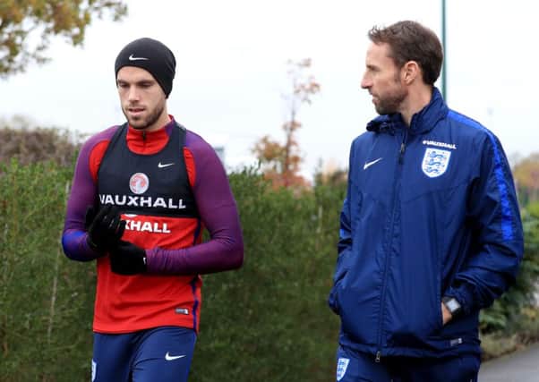 Gareth Southgate talks with Jordan Henderson yesterday after naming him as England captain. Picture: PA