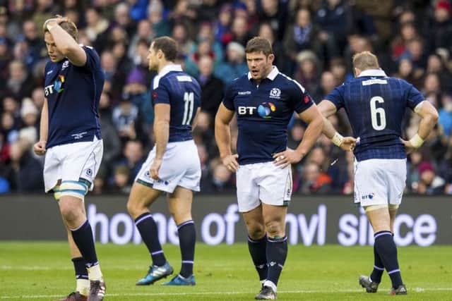 Dejection for Scotland's players at full-time. Picture: SNS