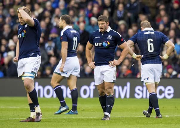 Dejection for Scotland's players at full-time. Picture: SNS