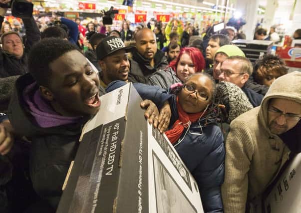 Black Friday may not always generate the bargains shoppers think it does. Picture: Ray Tang/REX/Shutterstock