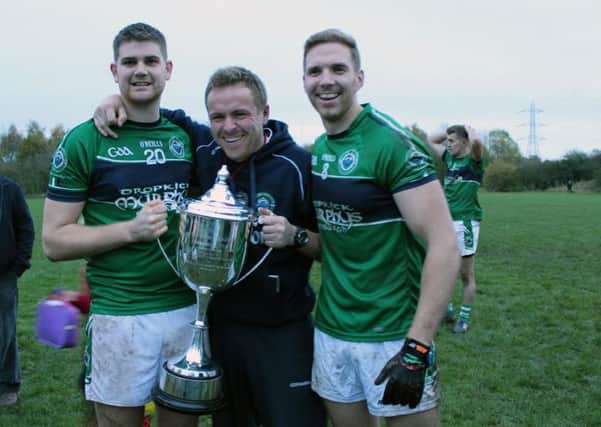Manager Cormac O'Gara, centre, with Robbie Howe (left) and club captain Brian McAteer. Picture: Mairead Keating