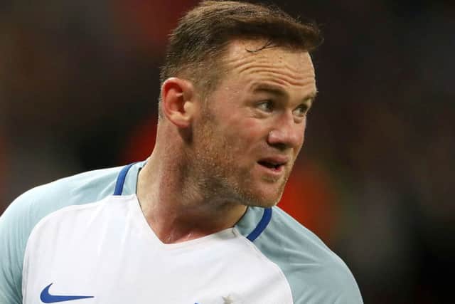 Wayne Rooney: Posed for pictures at a wedding. Picture: PA