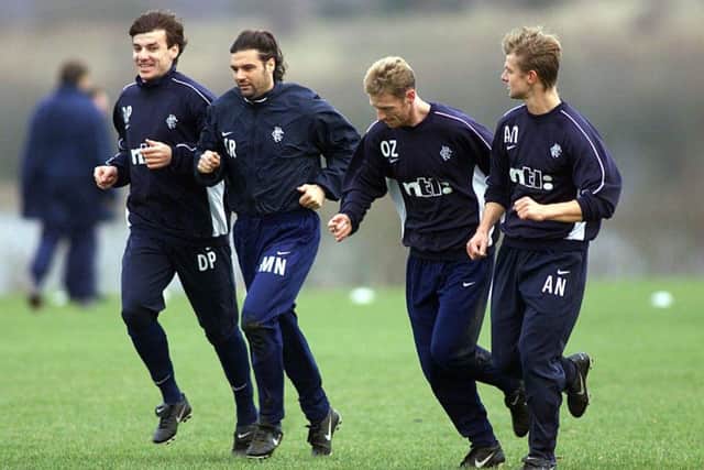 Daniel Prodan, far left, trains with Rangers players Marco Negri, Craig Moore and Arthur Numan. Picture: SNS.