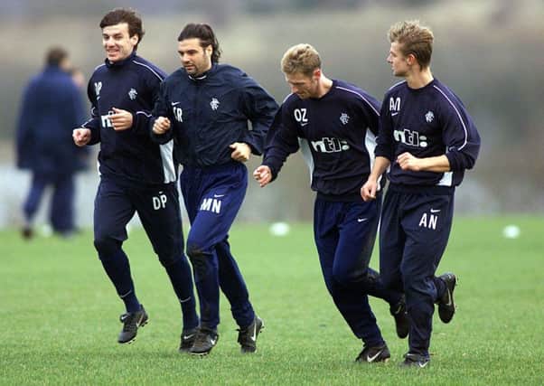 Daniel Prodan, far left, trains with Rangers players Marco Negri, Craig Moore and Arthur Numan. Picture: SNS.