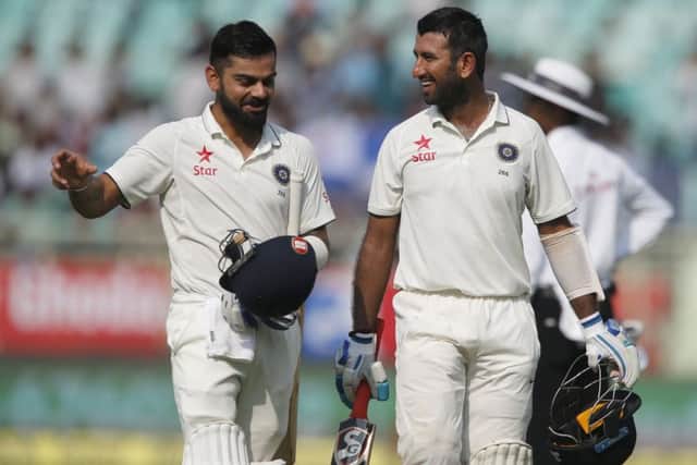 India captain Virat Kohli, left, and Cheteshwar Pujara both made centuries on the first day of the second Test against England. Picture: AP Photo/Aijaz Rahi