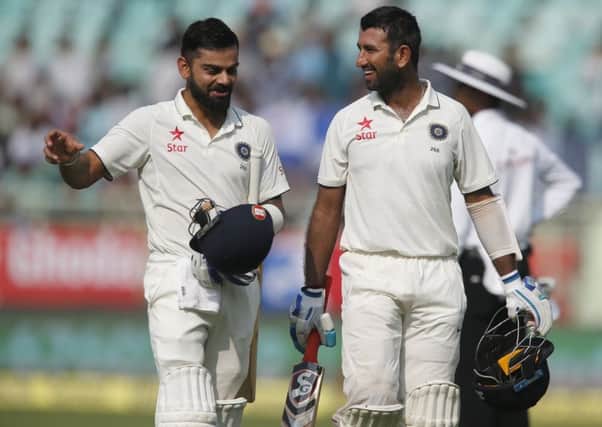 India captain Virat Kohli, left, and Cheteshwar Pujara both made centuries on the first day of the second Test against England. Picture: AP Photo/Aijaz Rahi