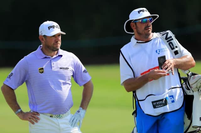 Lee Westwood and stand-in caddie Ken Herring in conversation during the first round of the DP World Tour Championship at Jumeirah Golf Estates. Picture: Getty Images