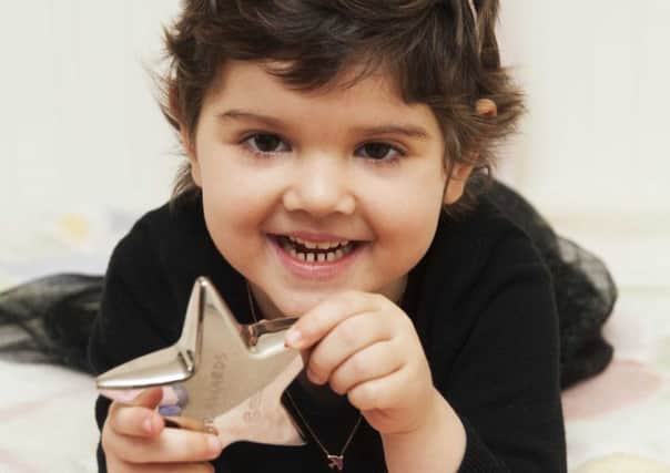 Leukaemia survivor Lydia with her star. Picture: Mark Anderson/Contributed