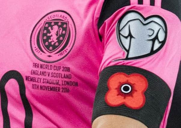 Scotland players wore poppies on their armbands during last week's World Cup qualifier at Wembley