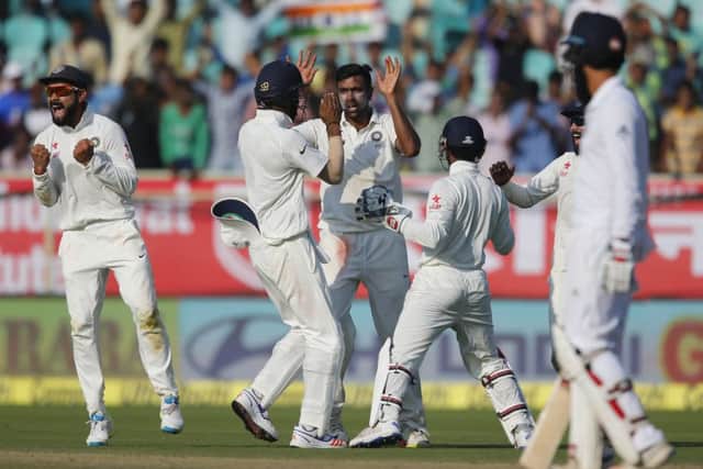 India's Ravichandran Ashwin, centre, celebrates with his teammates after the dismissal of England's Joe Root on the second day of the 2nd Test in Visakhapatnam. Picture: Aijaz Rahi/AP