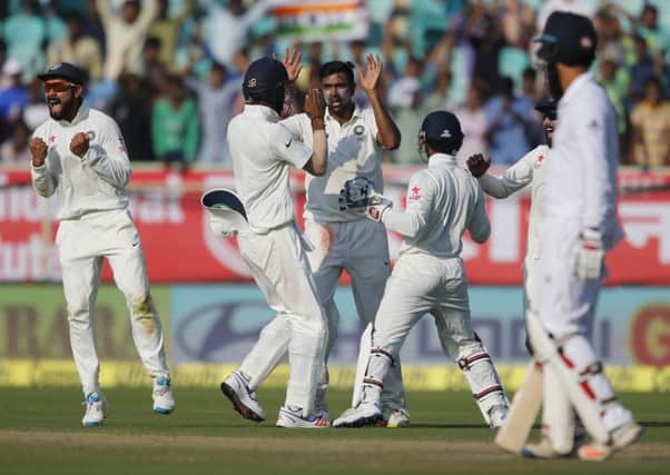 India's Ravichandran Ashwin, centre, celebrates with his teammates after the dismissal of England's Joe Root on the second day of the 2nd Test in Visakhapatnam. Picture: Aijaz Rahi/AP