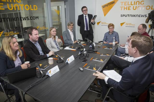 Staff meet at the Edinburgh office of Sputnik, a Russian news agency, in August. Picture: Contributed