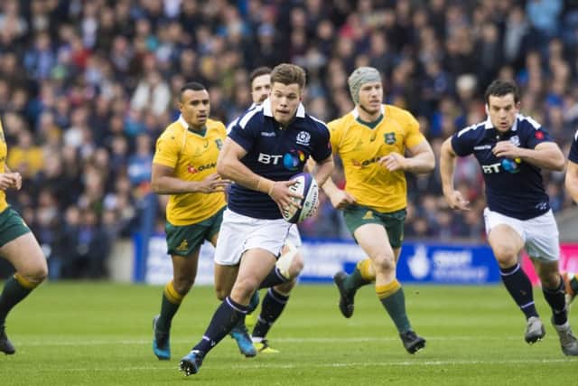 Scotland's Huw Jones runs through to score his side's first try in the defeat by Australia. Picture: SNS