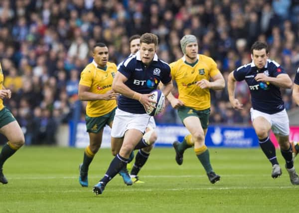 Scotland's Huw Jones runs through to score his side's first try in the defeat by Australia. Picture: SNS