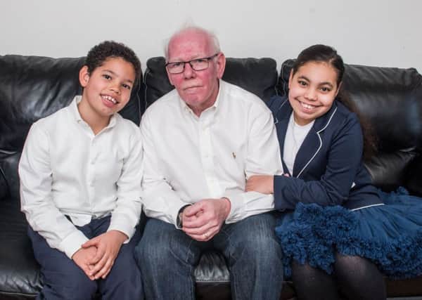 John Wallace, with children Keir and Rowan. Keir is the UKs only child with Familial Cold Autoinflammatory Syndrome Type 2. Photograph: Ian Georgeson