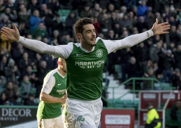 Brian Graham celebrates scoring Hibs' opening goal versus Queen of the South. Picture: SNS