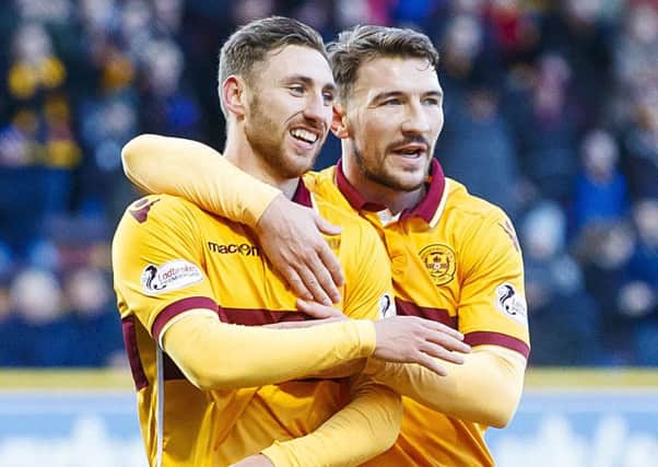 Louis Moult, left, is congratulated by Craig Clay after his opener. Picture: Roddy Scott/SNS