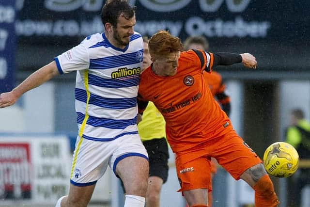 Mortons Gavin Gunning challenges Uniteds Simon Murray.  Photograph: SNS