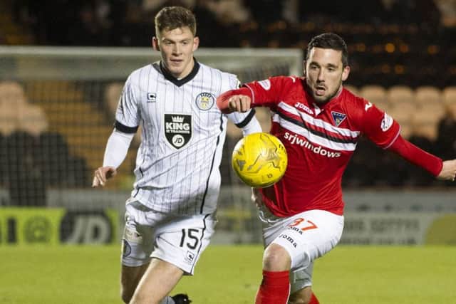 Dunfermline's Nicky Clark holds off St Mirren's Jack Baird. Picture SNS