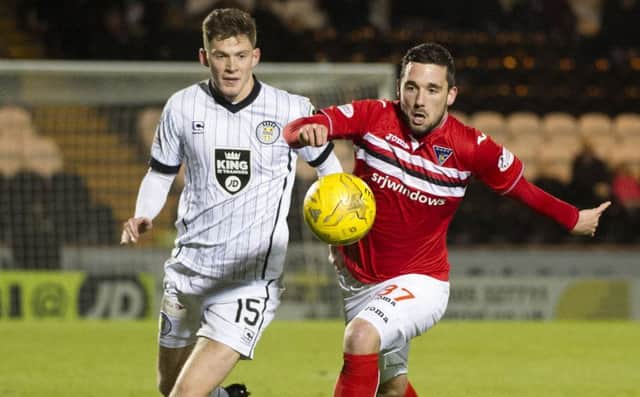 Dunfermline's Nicky Clark holds off St Mirren's Jack Baird. Picture SNS