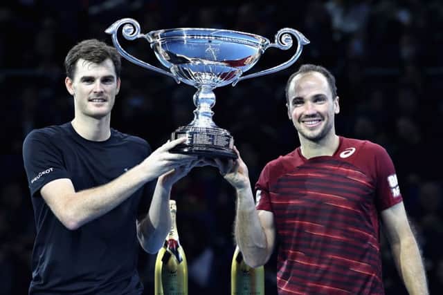 Jamie Murray and Bruno Soares of Brazil celebrate being crowned the Number 1 Men's Doubles Team in the world after their men's doubles semi final. Photo: Julian Finney/Getty