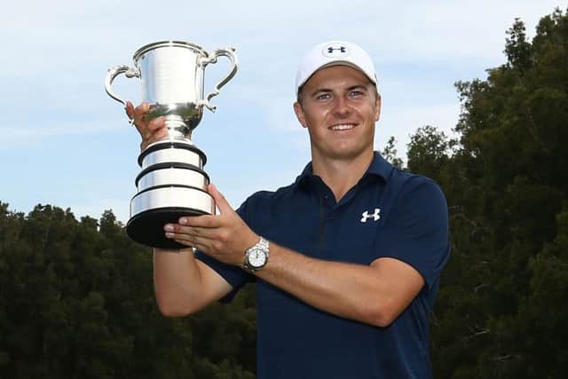 Jordan Spieth lifts the Stonehaven Cup for the second time in three years after his play-off win in the Australian Open. Picture: Getty Images