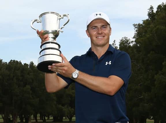 Jordan Spieth lifts the Stonehaven Cup for the second time in three years after his play-off win in the Australian Open. Picture: Getty Images