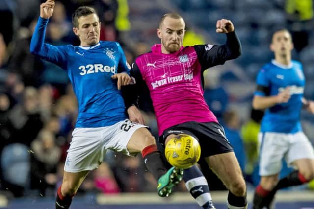 Rangers' Jason Holt, left, battles with Dundee's James Vincent during the Premiership clash at Ibrox. Picture: Craig Williamson/SNS