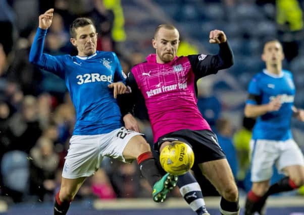 Rangers' Jason Holt, left, battles with Dundee's James Vincent during the Premiership clash at Ibrox. Picture: Craig Williamson/SNS