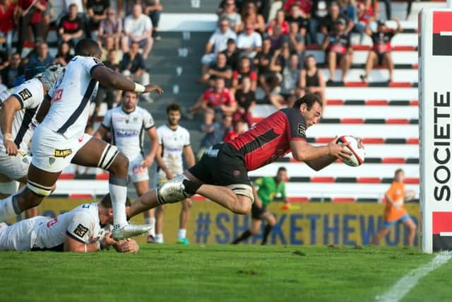 Georgia skipper Mamuka Gorgodze scores the winning try for Toulon after evading a tackle from Clermonts French hooker during a Top 14 match. The flanker is one of a number of Georgian internationals who play key roles for Top 14 clubs. Picture: Bertrand Langlois/AFP/Getty