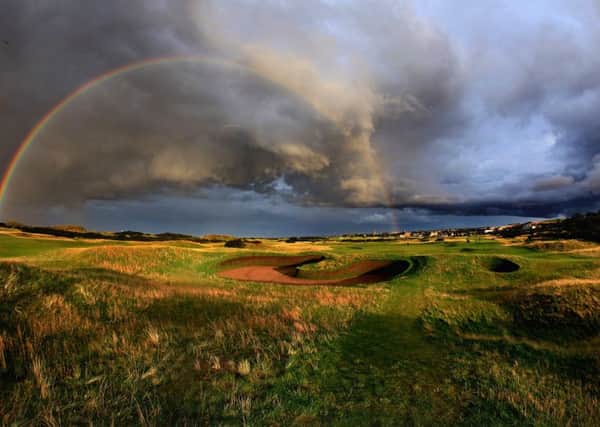 A rainbow on a very stormy evening on the par 5, 14th hole which shares it's green with the 4th hole (left) is protected by the famous 'Hell Bunker'. (Photo by David Cannon/Getty Images)