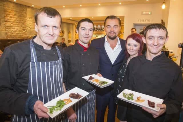 Hollywood actor Leonardo DiCaprio poses with formerly homeless staff at Social Bite's restaurant Home in Edinburgh. Picture: Jeff Holmes/Getty Images