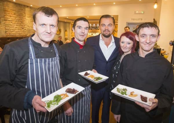 Hollywood actor Leonardo DiCaprio poses with formerly homeless staff at Social Bite's restaurant Home in Edinburgh.  Picture: Jeff Holmes/Getty Images