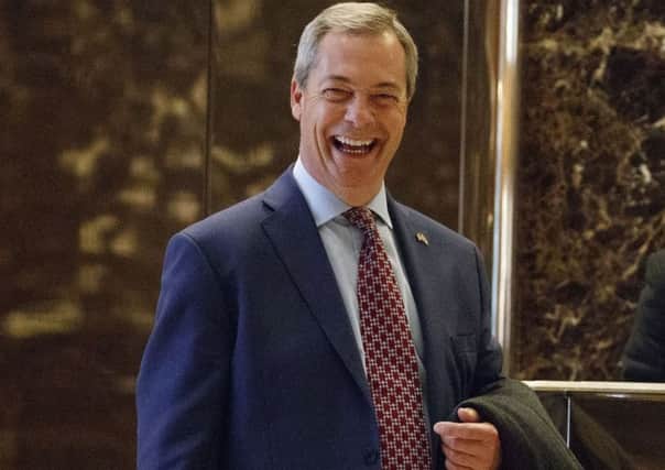Nigel Farage smiles  at Trump Tower (AP Photo/ Evan Vucci, File)