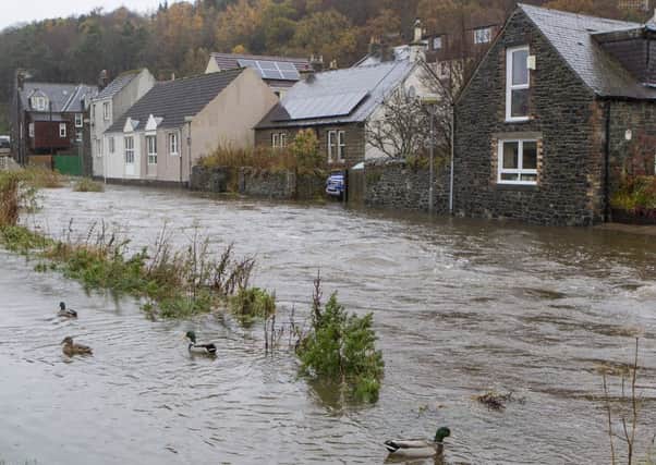 Eddleston Water in Peebles breaks it's banks and threatens to flood nearby properties. Picture: SWNS