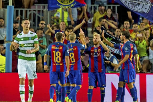 Lionel Messi and team-mates celebrate their 7-0 victory over Celtic at the Nou Camp.